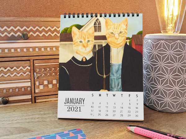 cat calendar on desk