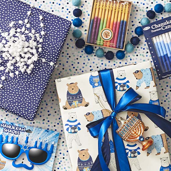Assorted Hanukkah items including wrap, candles, ornaments and more